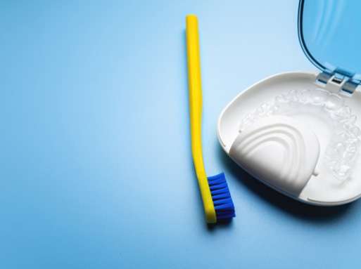 Invisalign tray in case near toothbrush