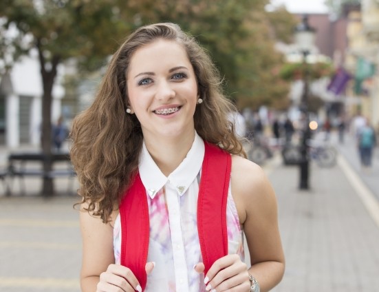 Smiling teenage girl with braces