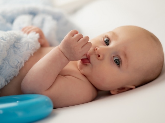 Baby sucking their thumb