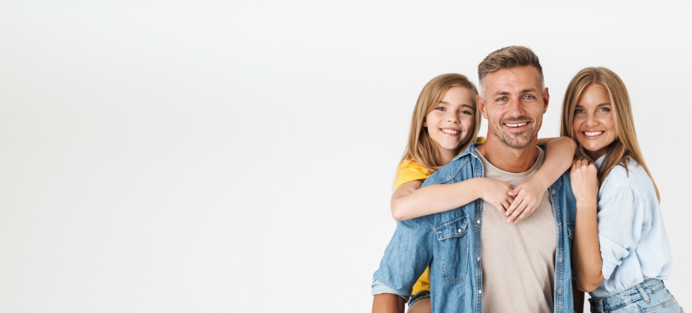 Family of three smiling after visiting pediatric emergency dentist in Dublin