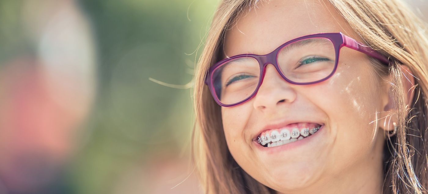 Patient in Dublin smiling with metal braces