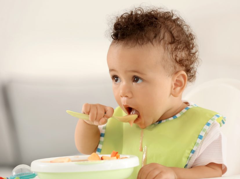 Toddler eating from bowl